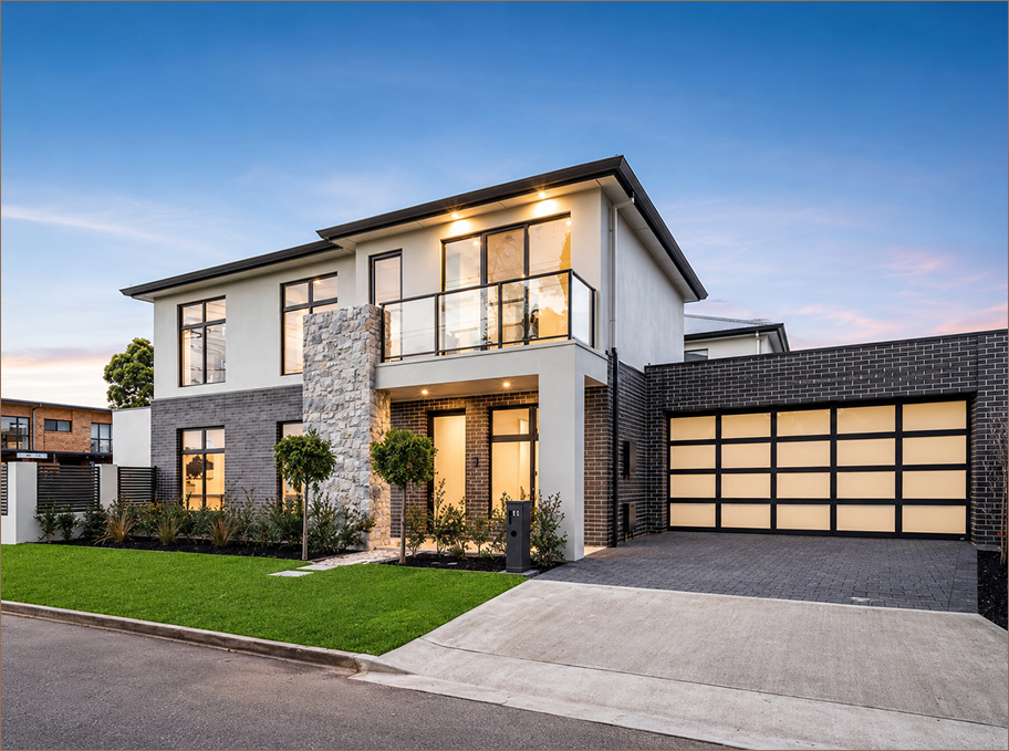 High-end custom home exterior at dusk
